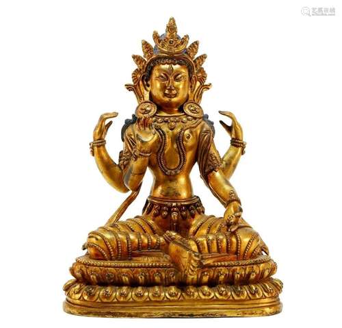 A gilt bronze Four armed Guanyin statue