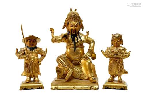 Three gilt bronze Guangong statues