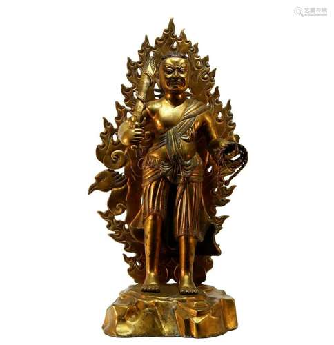 A superb gilt bronze Tibetan statue