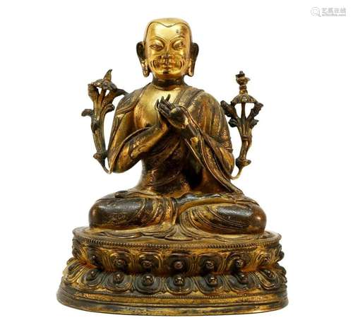 A gilt bronze Tibetan Guru statue