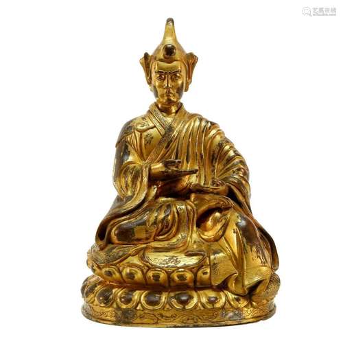 A gilt bronze Tibetan Guru statue