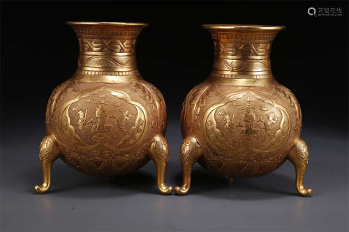A Set of Gilt Copper Tripod Bottles.