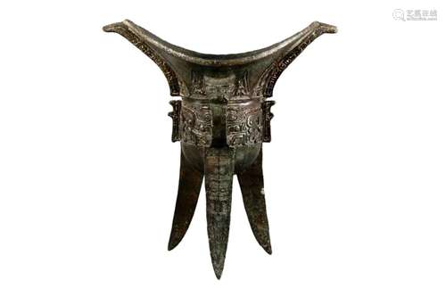 A Bronze 'Beast Face' Cup