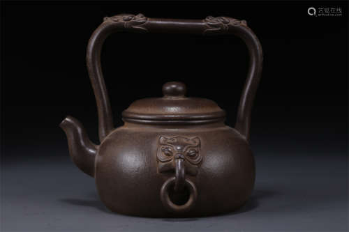 A Purple Clay Teapot with Ringlike Ears.
