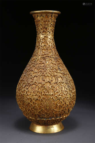 A Gilt Copper Bottle with Flowers Design.