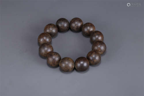 A Bracelet of Agarwood Beads.