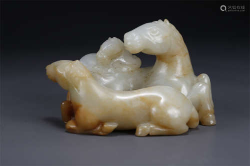 A Hetian Jade Lying Horse Sculpture.