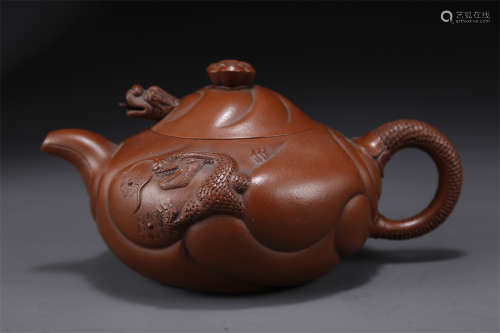 A Purple Clay Teapot with Bat&Dragon Design.