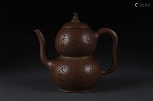 A Gourd Shaped Purple Clay Teapot.