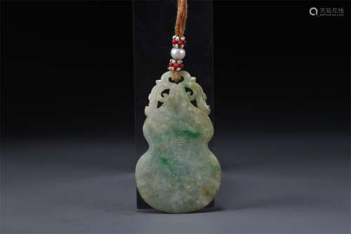 A Gourd Shaped Jadeite Pendant.