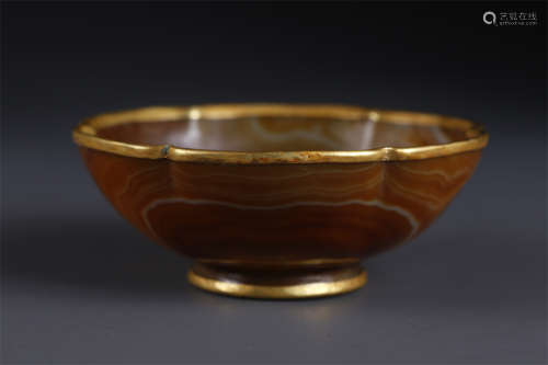 An Agate Saucer with Flower Shaped Gold Rim.