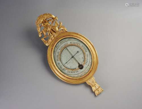 Barmètre thermomètre en bois sculpté doré à décor à l'am...