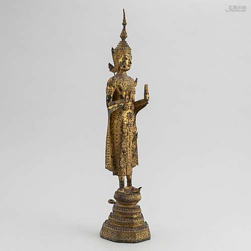 A Thai gilt bronze of standing Buddha Sakyamuni, 19th Centur...
