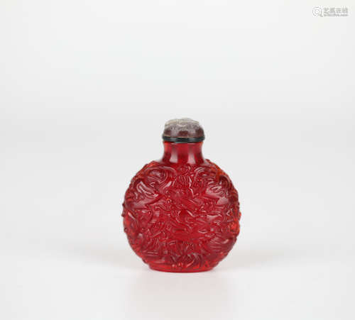 Red glaze carved dragon snuff bottle