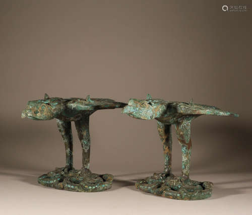 A pair of bronze inlaid pine, stone and swallow in the war a...