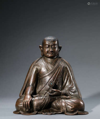 A Chinese Bronze Guru Statue