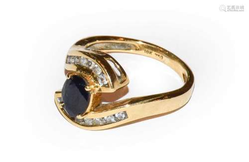 A sapphire and diamond ring, stamped 18K and 750, finger siz...