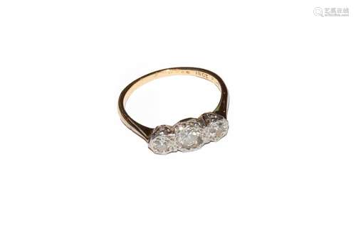 A diamond three stone ring, stamped 18CT and PLAT, finger si...