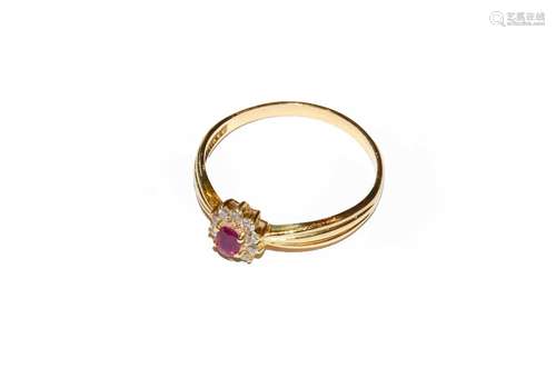 A ruby and diamond cluster ring, unmarked, finger size SCond...