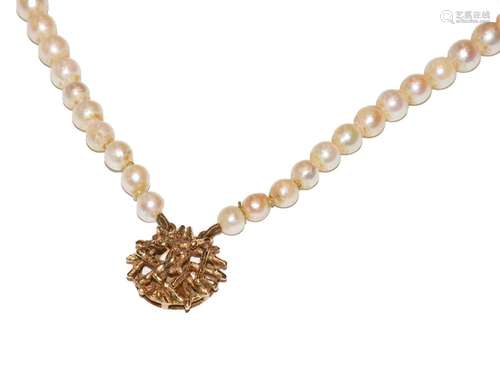 A graduated two row cultured pearl necklace knotted to a 9 c...