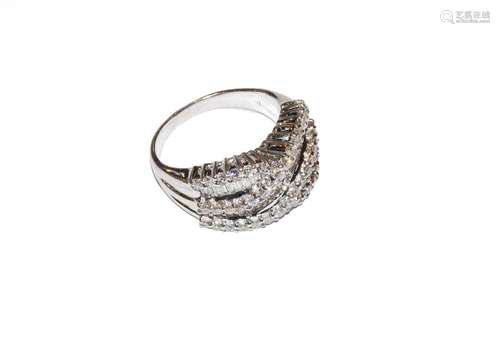 A diamond two row twist ring, stamped 14K, finger size M1/2C...