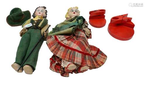 A pair of mid 20th century Lenci dolls with pottery shoulder...
