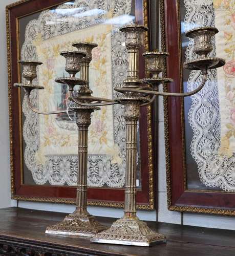 A pair of silver-plated two branch sconce candelabra, raised...