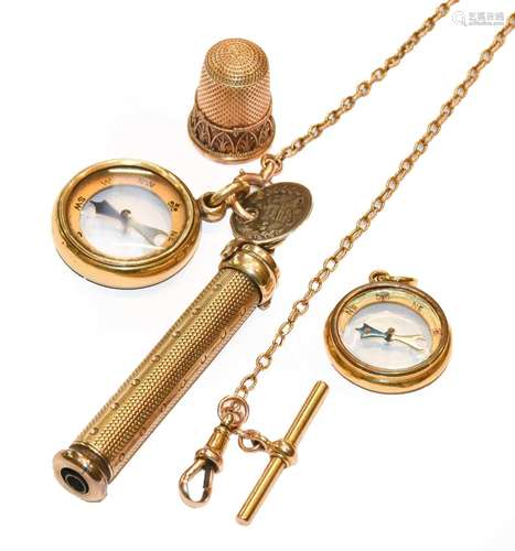 A gilt propelling pencil, on a chain with a compass pendant ...