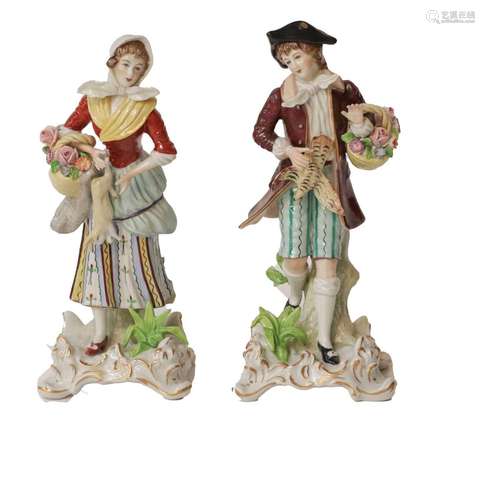 A pair of 20th century Sitzendorf figures carrying game and ...