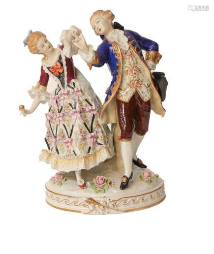 An early 20th century Sitzendorf figure group of a dancing c...