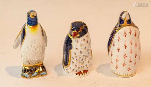 Royal Crown Derby porcelain penguin paperweights, comprising...