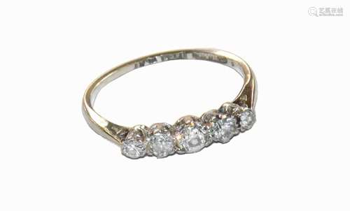 A diamond five stone ring, stamped 18CT and PLAT, finger siz...