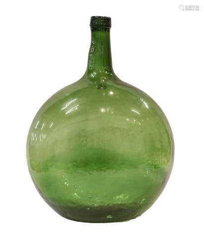 A large green glass bottle, approximately 47cm high