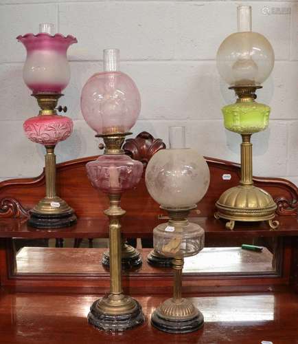 ~ Four Victorian brass based oil lamps including two with op...