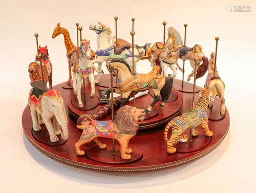 A quantity of ornamental items including a toy carousel, mod...