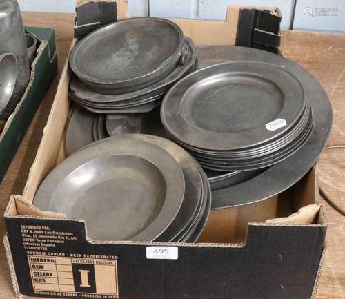 Twenty-seven old pewter plates, a charger etc