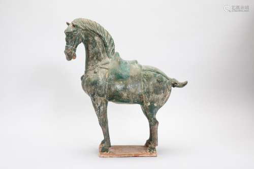 A TANG STYLE GREEN GLAZED MODEL OF A HORSE