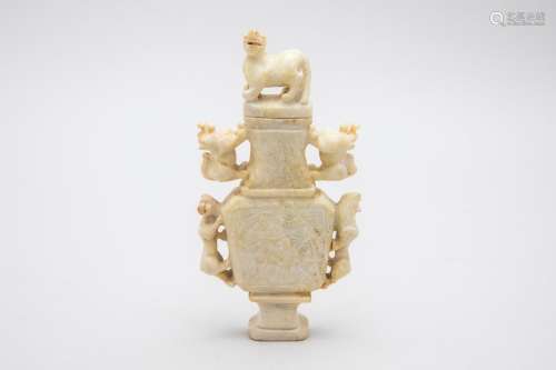 A CHINESE CARVED HARDSTONE VASE AND COVER