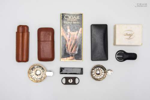 A COLLECTION OF CIGAR CUTTERS AND ACCESSORIES