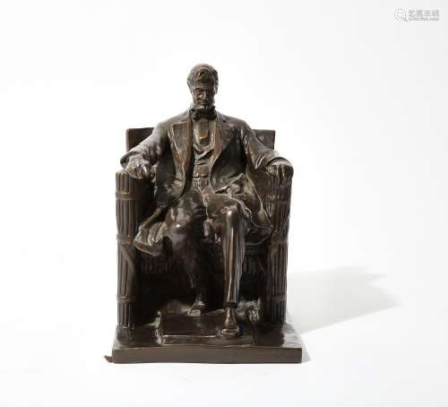 An American patinated bronze seated Abraham Lincoln, after a...
