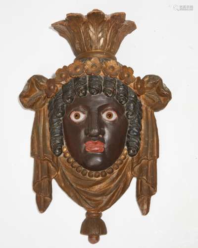 A Continental painted terracotta relief mask plaque, late 19...