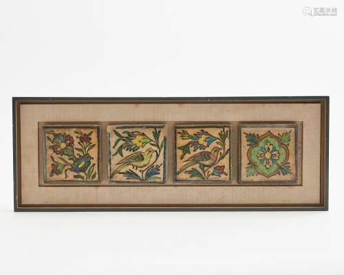 A set of four Persian glazed ceramic tiles