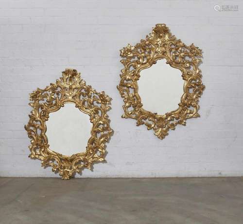 A pair of Italian Baroque style giltwood mirrors, 20th centu...