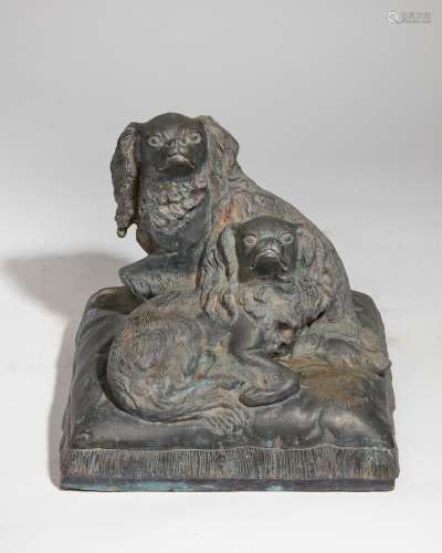 A French patinated metal group of spaniels, after the model ...