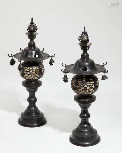 A pair of Japanese patinated bronze candle lanterns