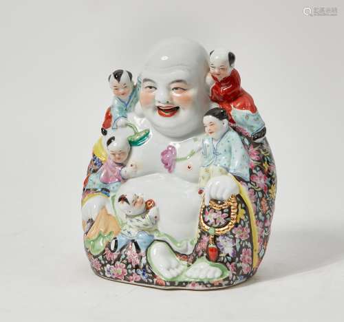 A Chinese porcelain model of Budai