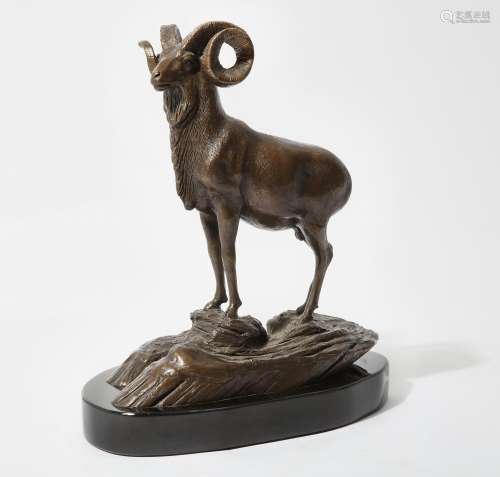 An American patinated bronze model of a ram on a rocky outcr...