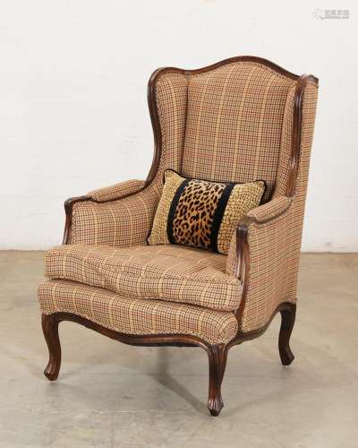 A Louis XV style wingback armchair, late 19th/early 20th cen...