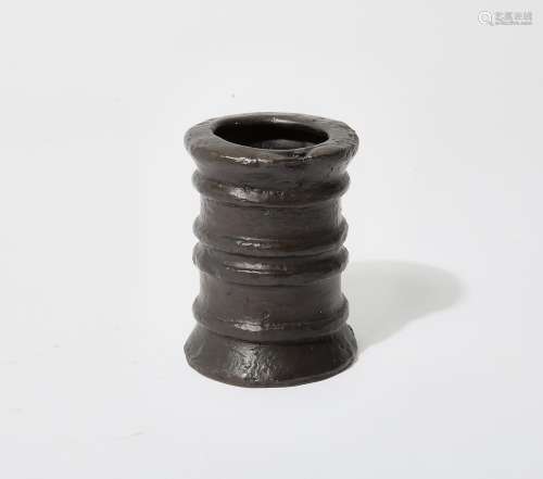 A patinated bronze cylindrical vase