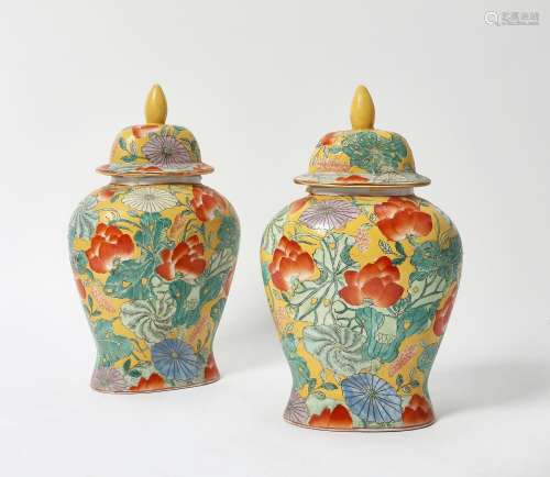 A pair of Chinese glazed earthenware covered vases